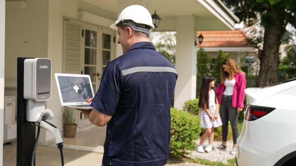 Qualified,Technician,Working,On,Home,Ev,Charging,Station,Installation,,Making